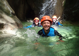 family canyoning in the water