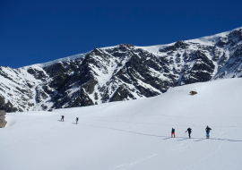 A group of ski tourers heading towards the glaciers