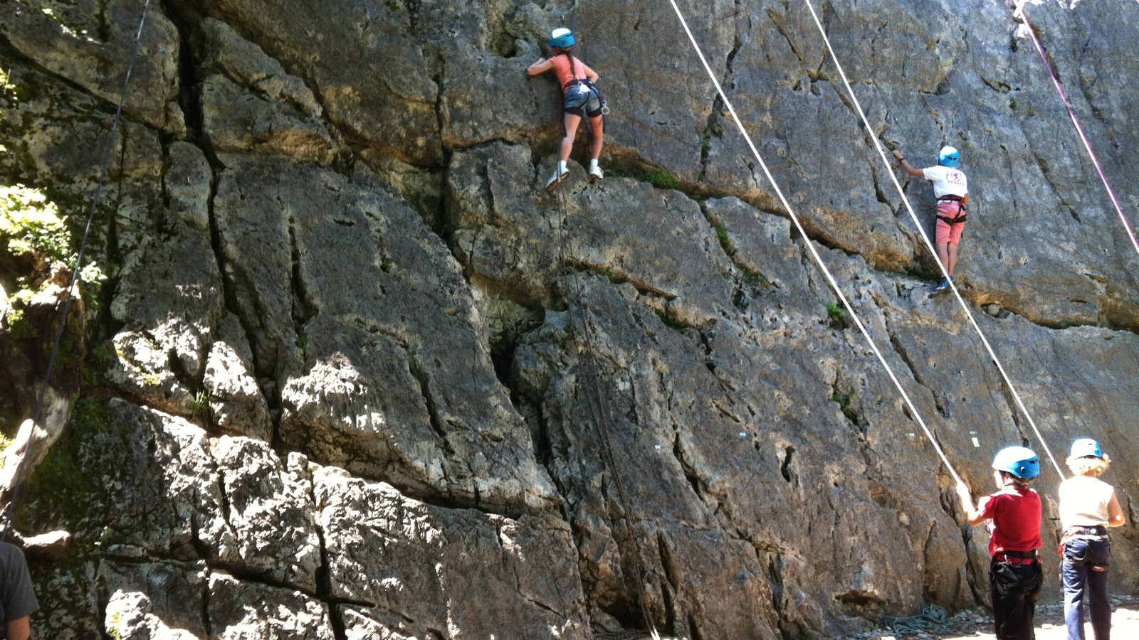 two belayed climbers