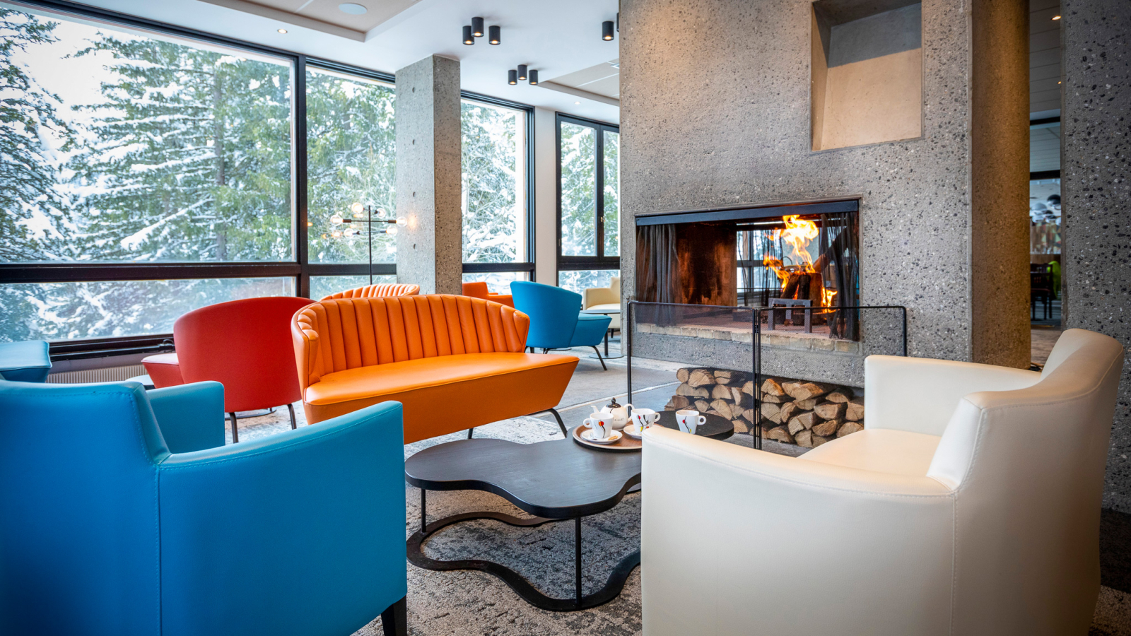 The Bauhaus-style fireplace at MMV Le Flaine, located on the first floor in the communal hall not far from the restaurant area