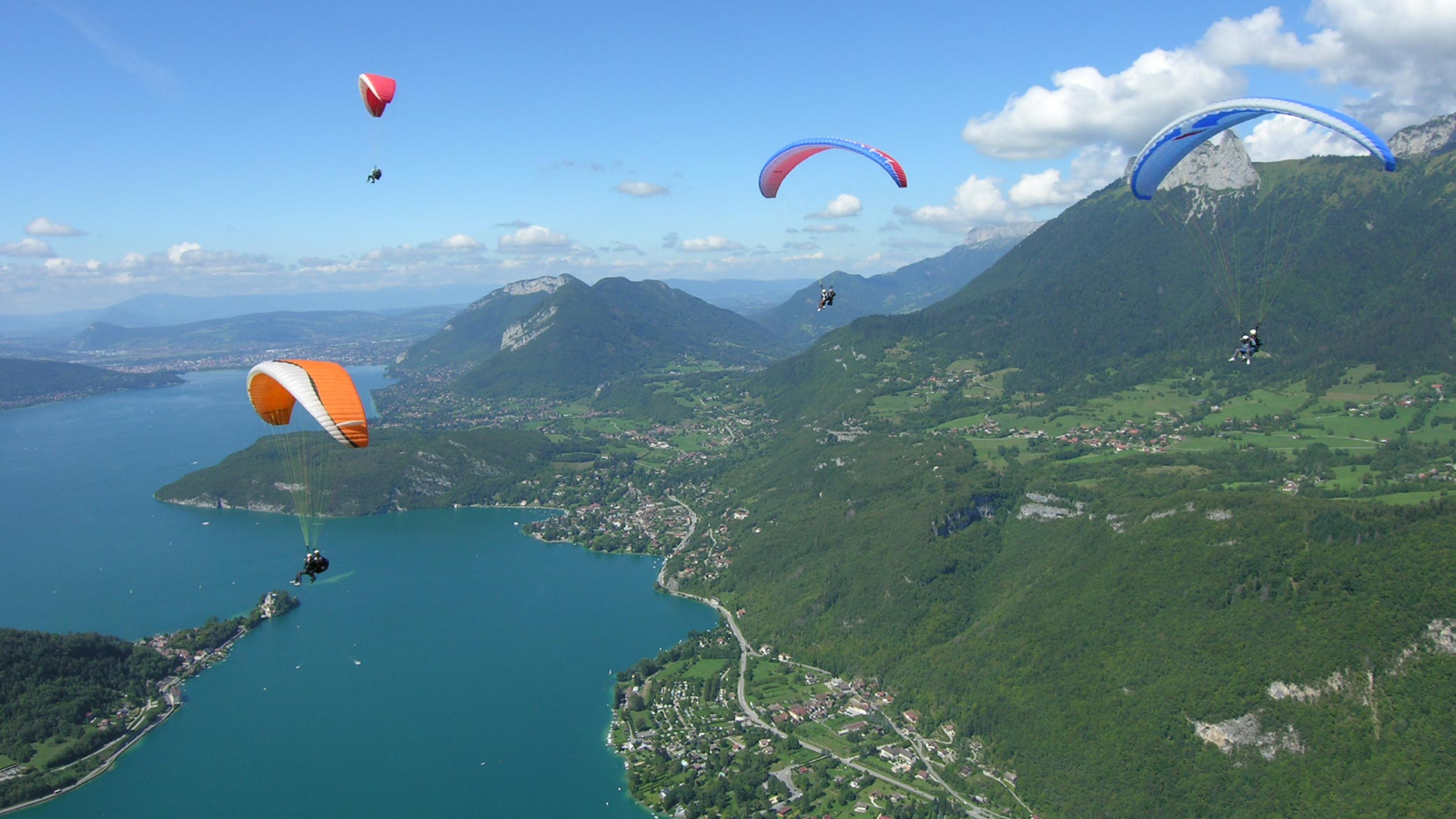 Paragliders above lake Annecy