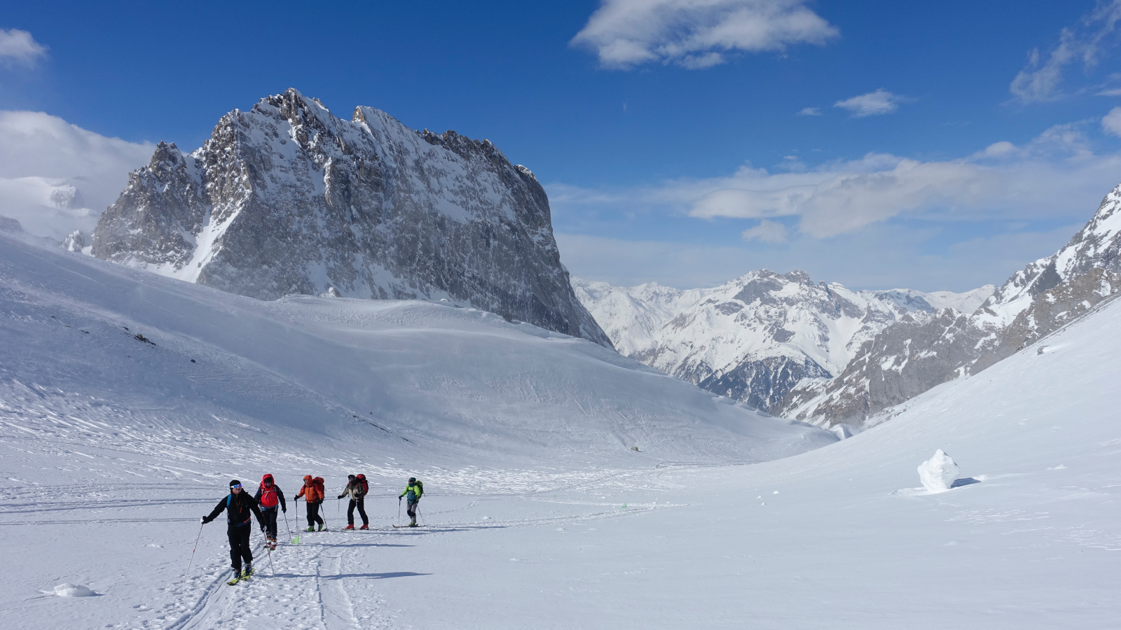 Group of skiers heading to the high peaks