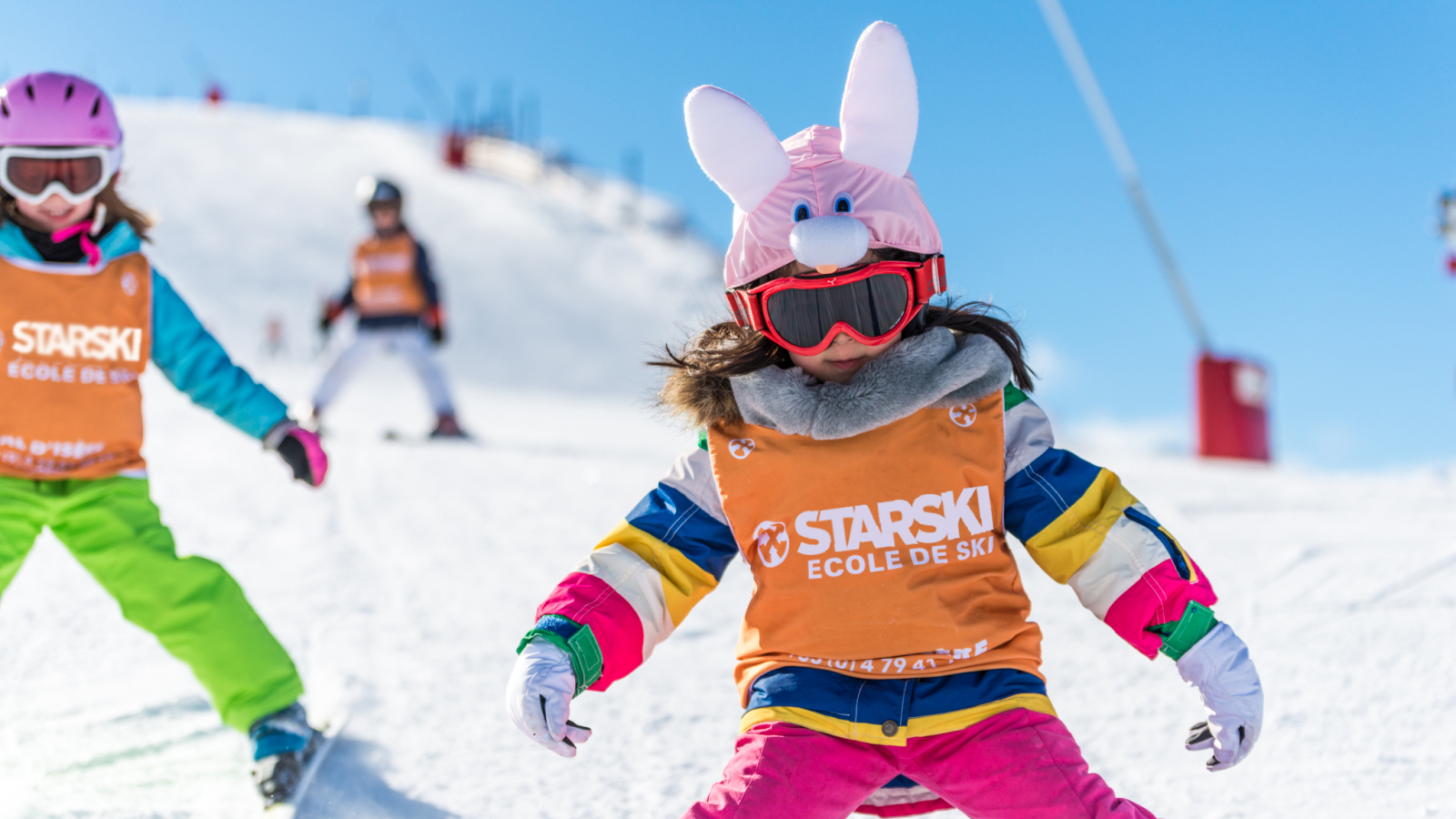 Children learn to ski whilst having fun.