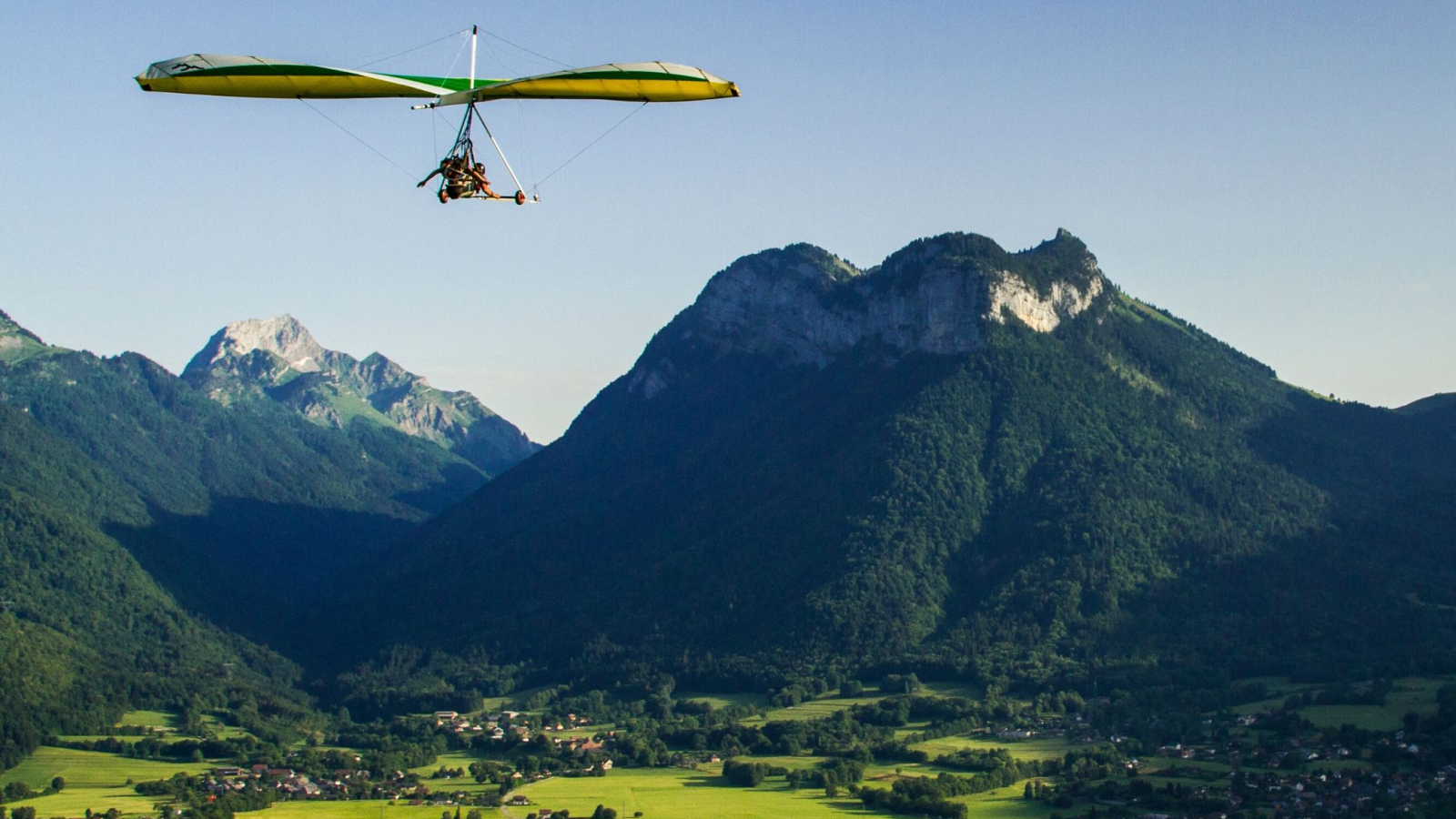 hang-gliding flight mountains and valley